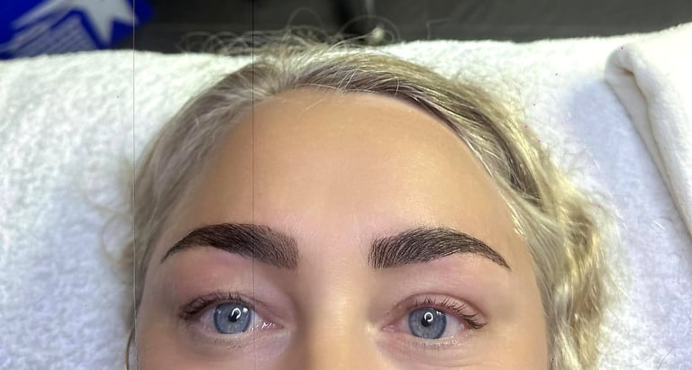 Close-up of a woman's face showing eyebrows, eyes, and forehead against a light-colored towel background